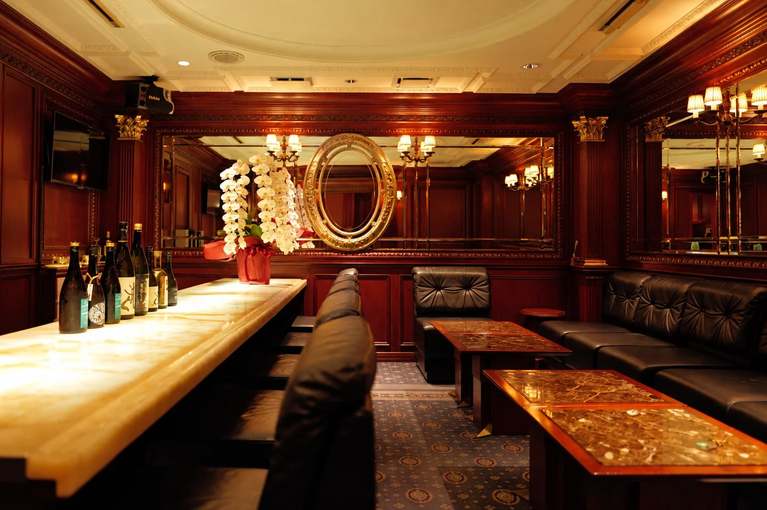 ENOVA lounge interior with warm lighting and orchids